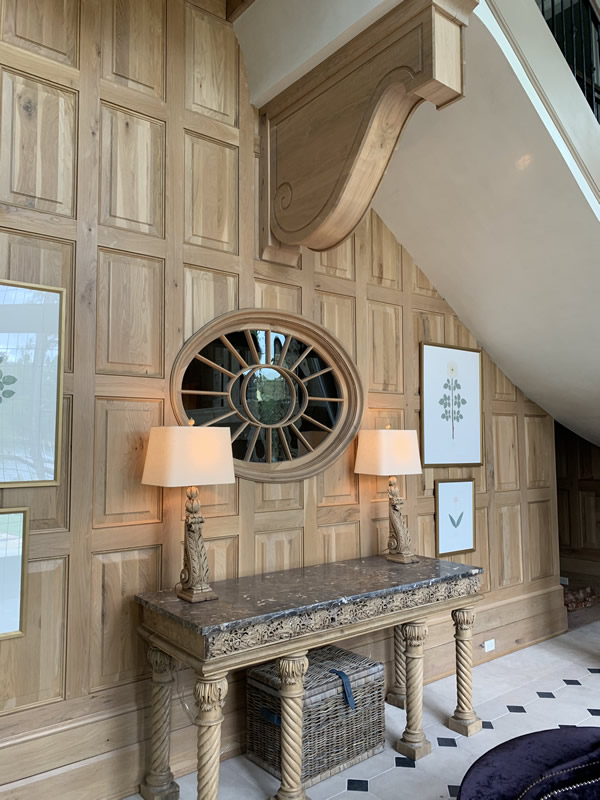 Wooden panelling under stairs